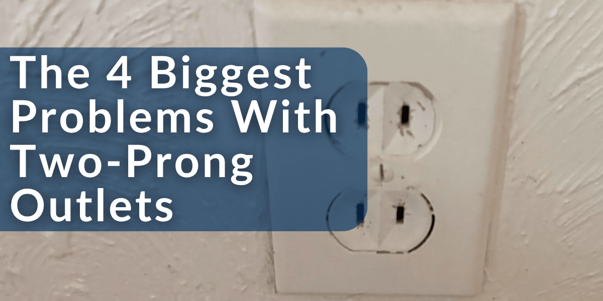 Two Prong outlet with text on blue box that reads 
