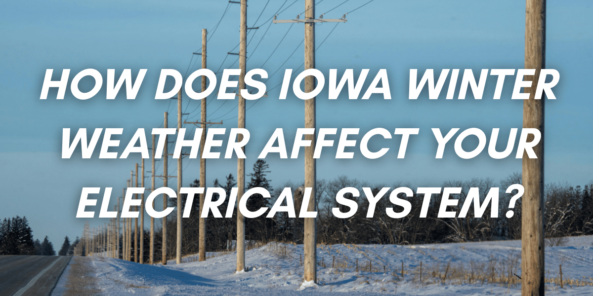 A picture of powerlines along a road during winter with snow
