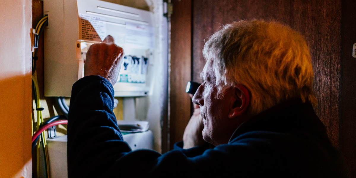 man fixing power outage in des moines iowa home