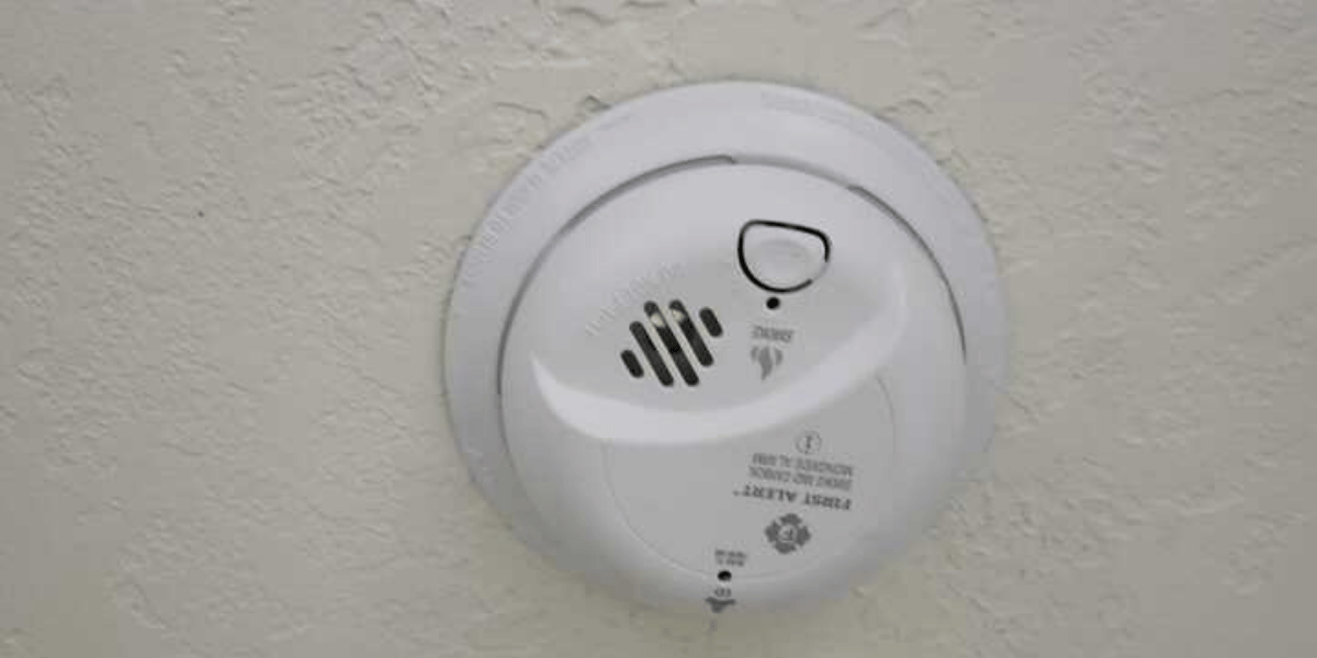 Ceiling-mounted smoke alarm on textured ceiling