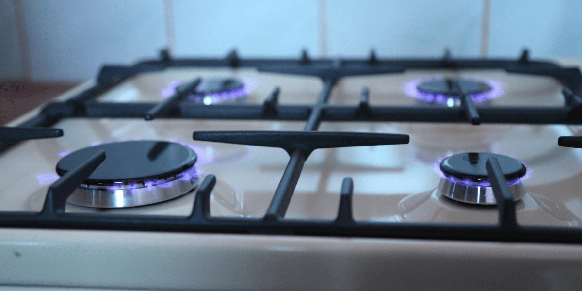 An electric stove with all the burners on