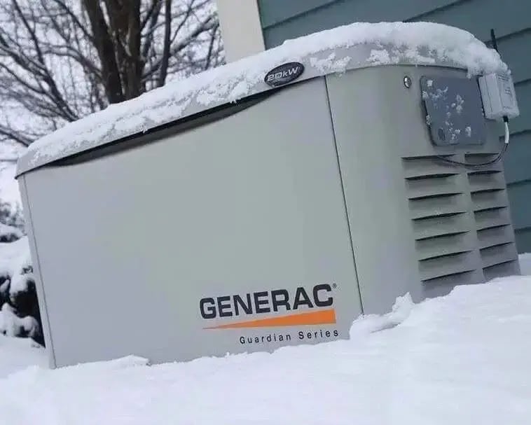 Generac standby home generator partially covered in snow during winter