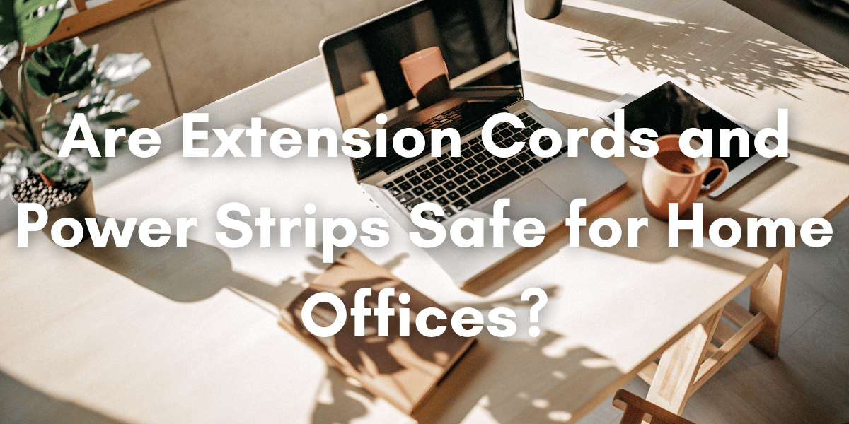 Home office desk with a laptop, tablet, coffee mug, and plants, overlaid with the title “Are Extension Cords and Power Strips Safe for Home Offices?”