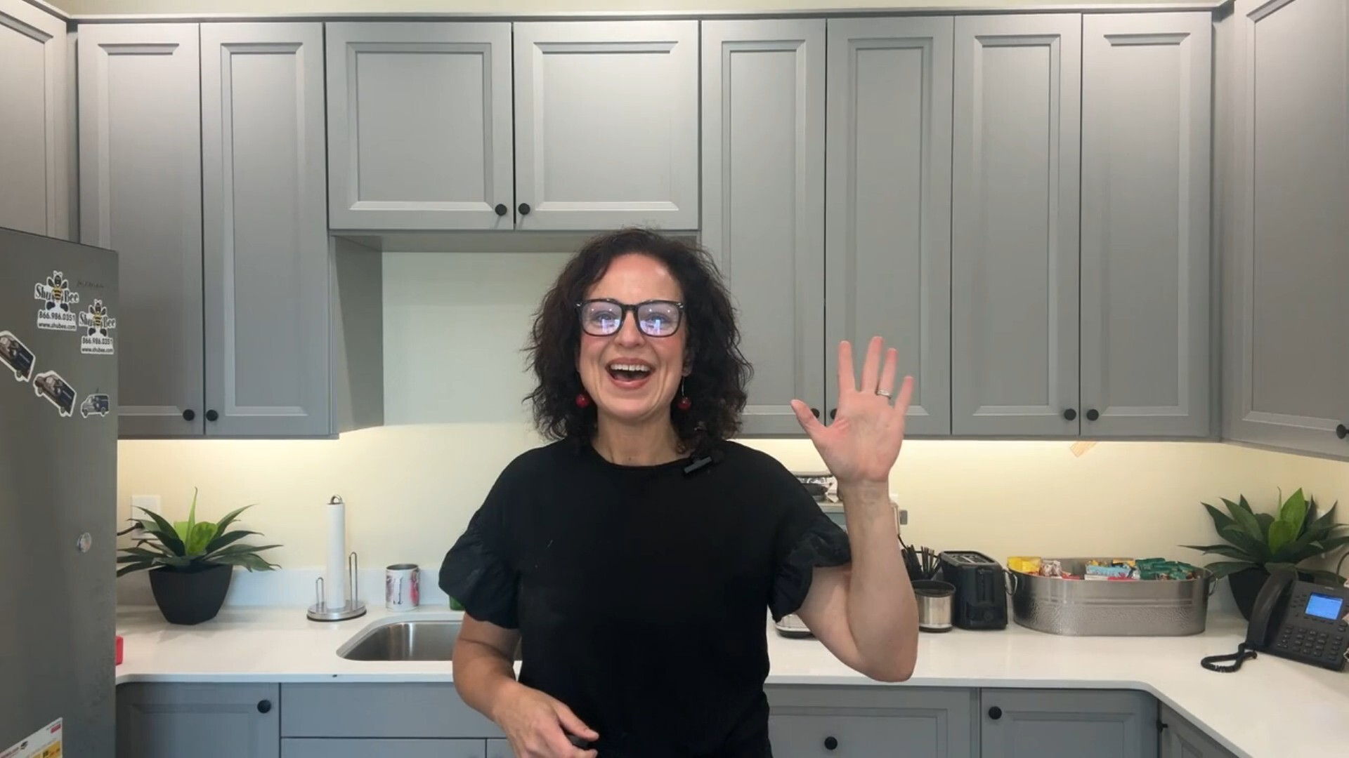 jaime waving in kitchen-1