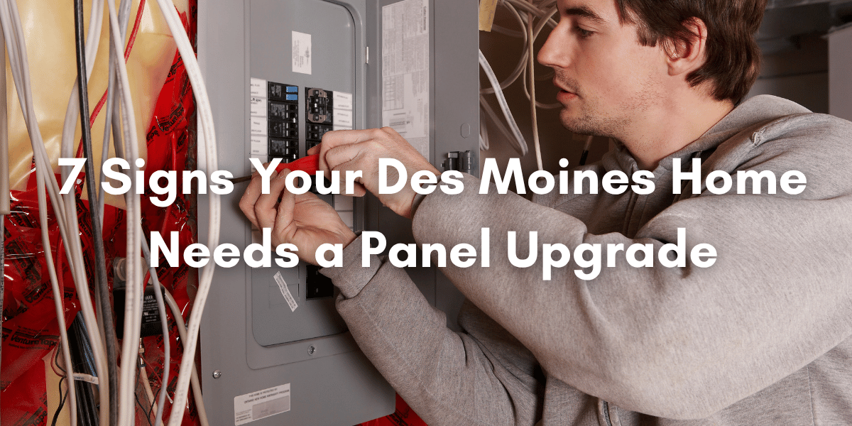 An electrician working on an electrical panel
